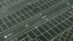 Learn about the difference between concrete and asphalt parking lots.