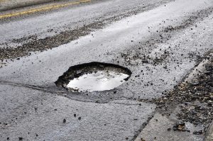 a pothole filled with rainwater